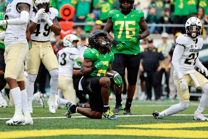 Oregon Ducks running back Noah Whittington celebrates after scoring a touchdown against the Colorado Buffaloes.